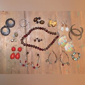 Lot of earrings with red/yellow/brown color theme